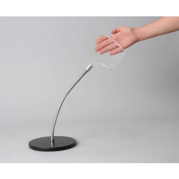 large rectangular goose neck stand magnifier with heavy black cast iron base and a hand behind lens