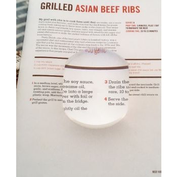 large  powerful rectangular dome magnifier with two flat sizes magnifying cook book vertical shot 