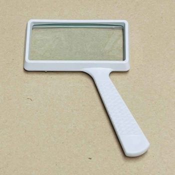 White rectangular glass lens magnifier with 2x magnification and a large 2x4" lens side view