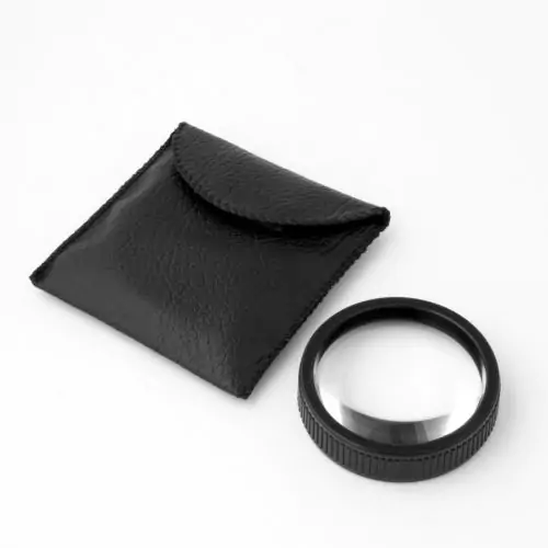 black hand lens 4x with 8x bifocal magnifier next to leatherette storage case made in USA